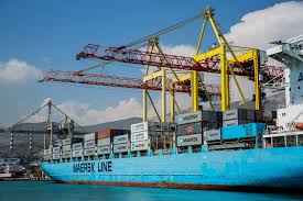 Container ship being loaded with gantry cranes