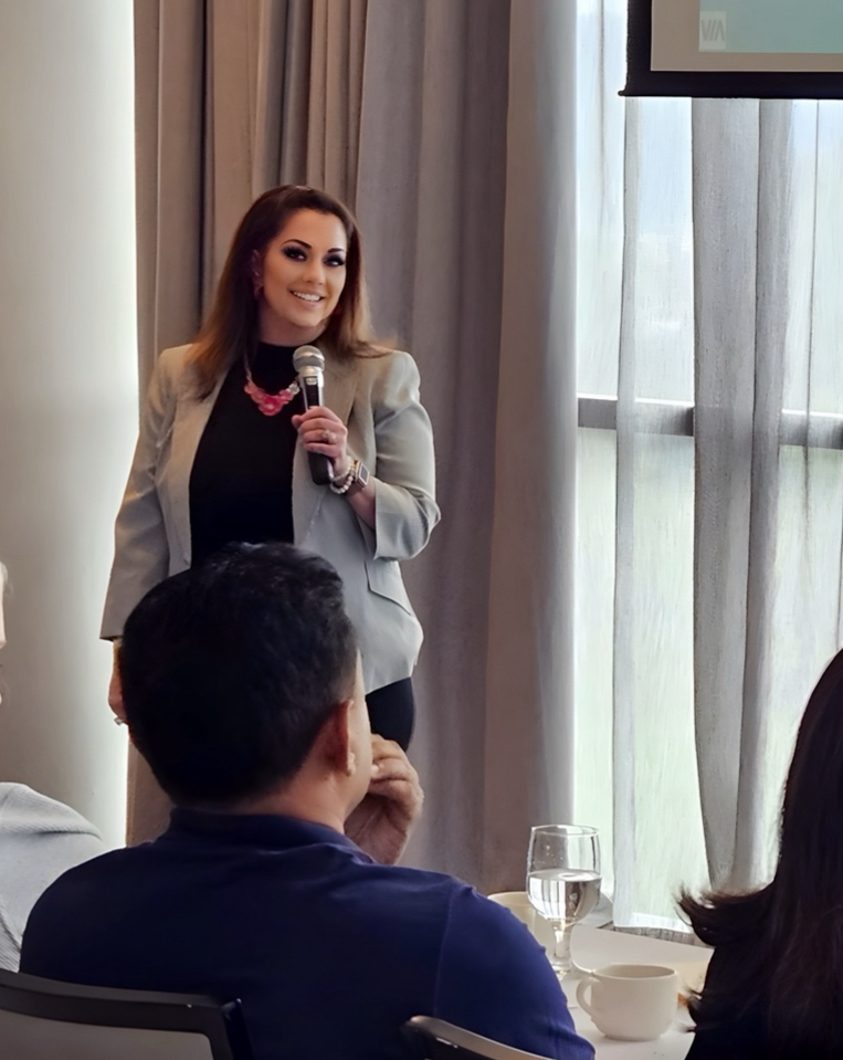 Holly Rivera presenting to Sunshine Energy team