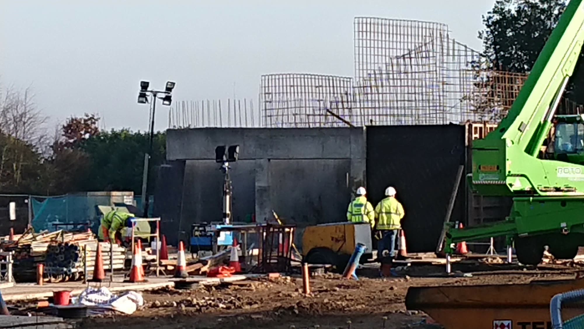 Construction of the zoological education and training centre, with reinforced concrete enclosure walls and steel reinforcement cages in place
